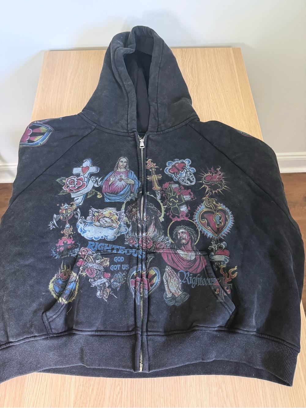 Black Graphic Zip-Up Hoodie with Religious Motif